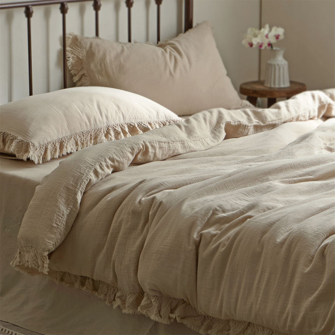 Washed linen bedding set with fringe trim and natural texture
