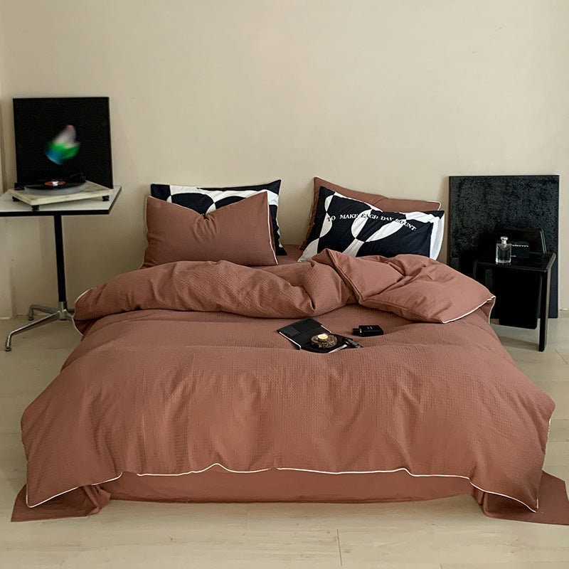 Textured cotton waffle duvet cover with pillowcases and fine contrasting piping