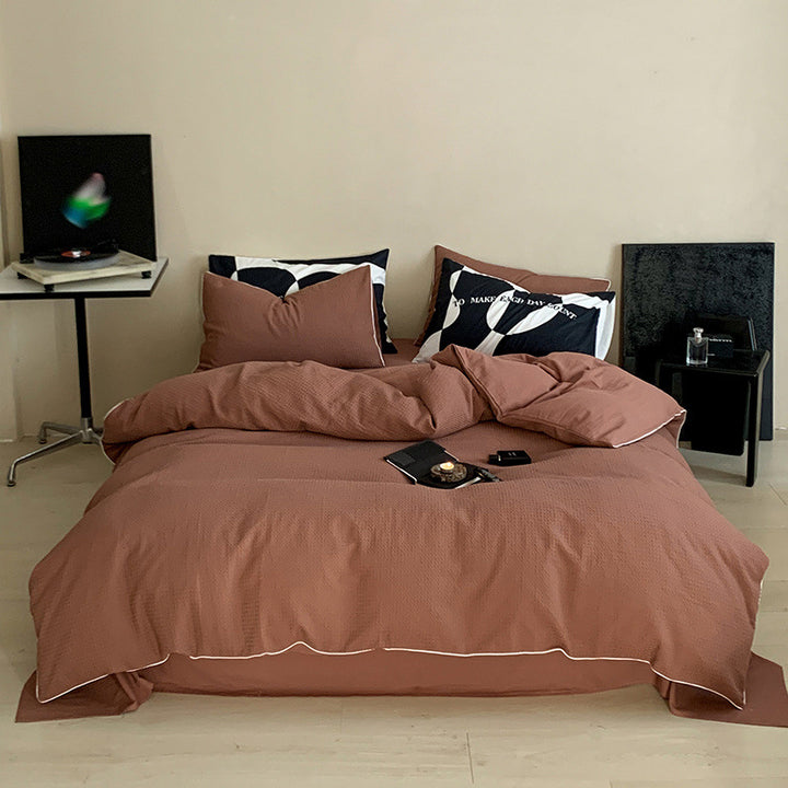 Textured cotton waffle duvet cover with pillowcases and fine contrasting piping