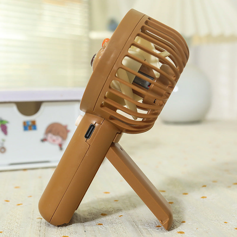 Unisex portable rechargeable USB hand fan with cute bear design and stand Stornfield