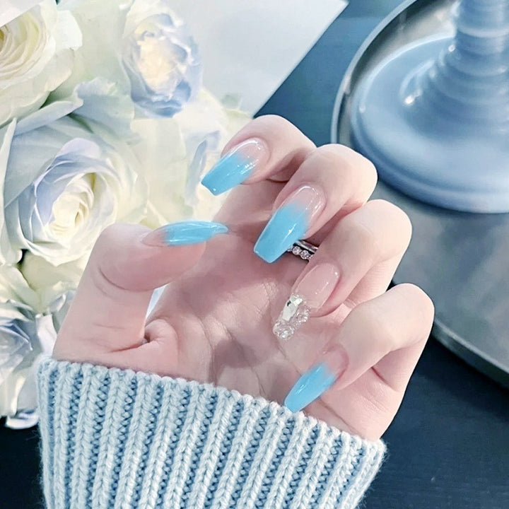 Nail set with elegant ombre and glitter accents Stornfield