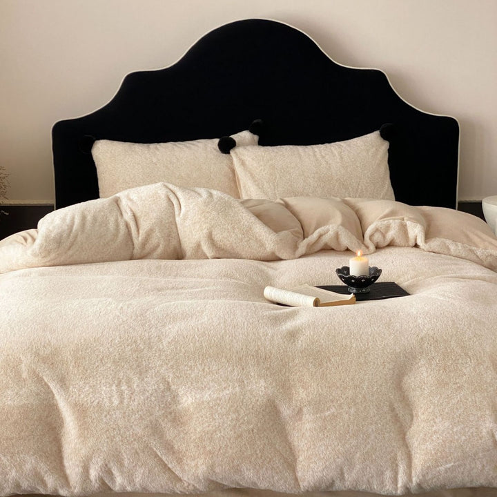 Bedding set made of soft cotton blend with decorative pom poms and reversible back