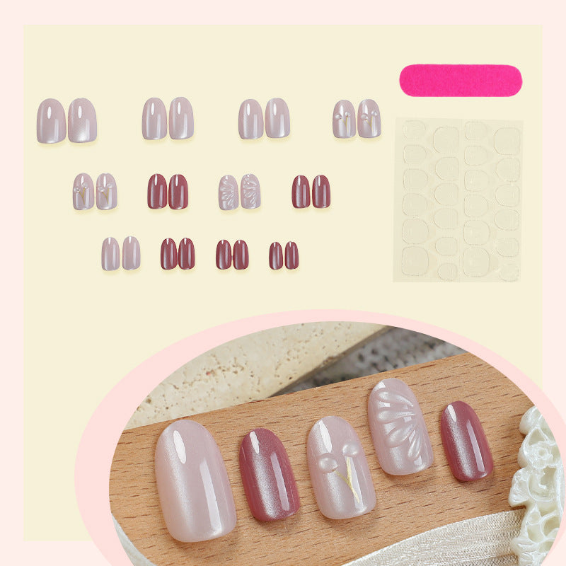 Acrylic nail set with elegant high-gloss finish and creative embellishments Stornfield