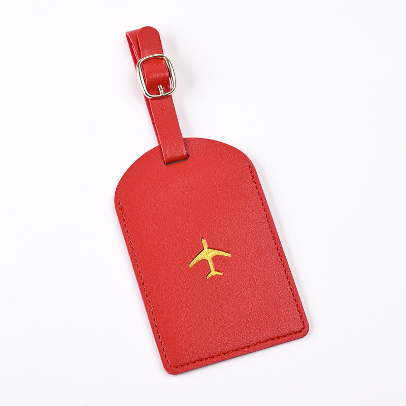 premium leather luggage tag with adjustable buckle strap and embossed airplane Stornfield