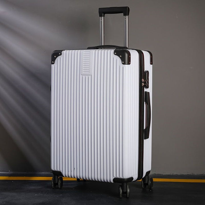 Hard shell suitcase with 360-degree wheel system and integrated safety feature Stornfield