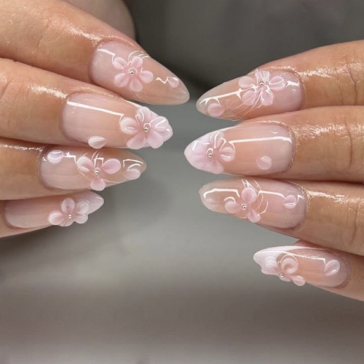 Artful stiletto nails with elegant floral design and glitter details Stornfield