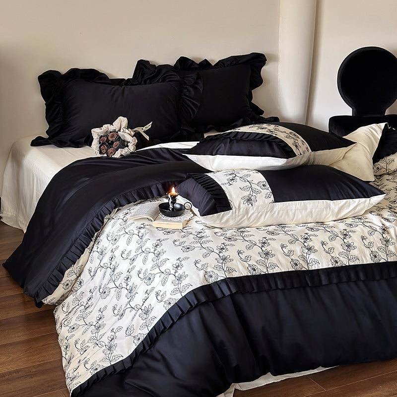 Luxurious cotton satin bedding set with ruffles and delicate floral embroidery