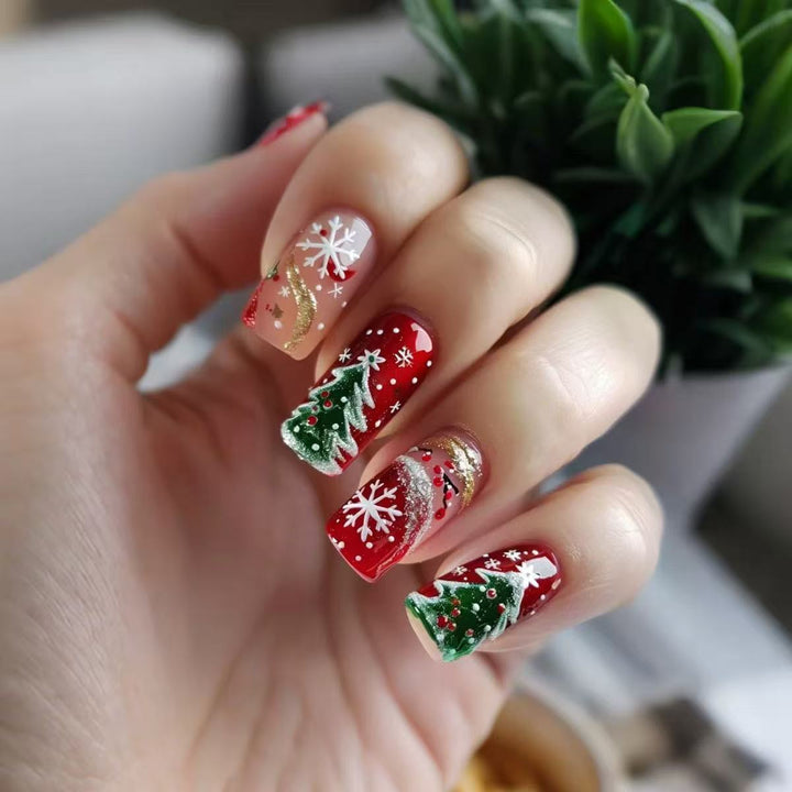 Artificial nail set with festive Christmas designs and glitter accents Stornfield