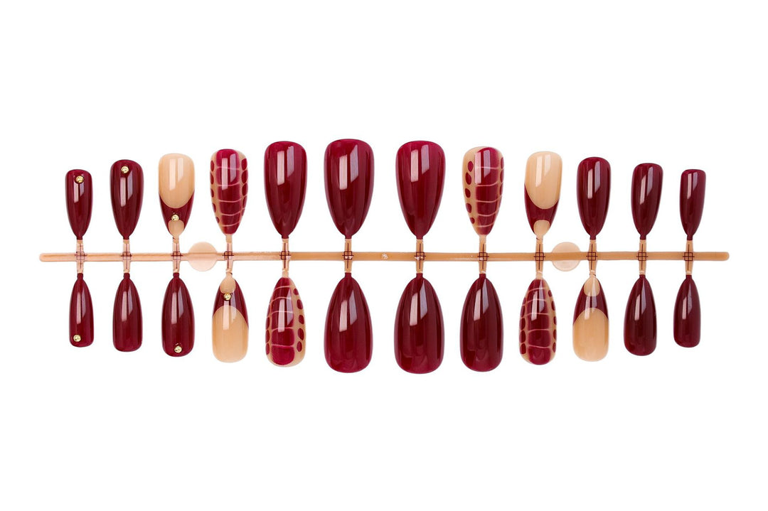 Acrylic nail set with elegant golden accents and trendy design Stornfield
