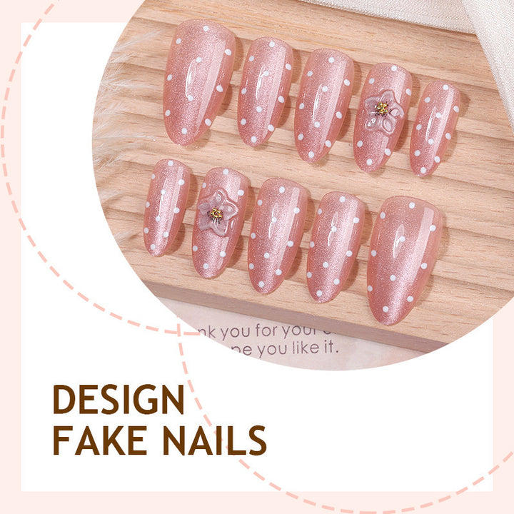 Artificial nail set with glitter and delicate floral and rhinestone embellishments Stornfield