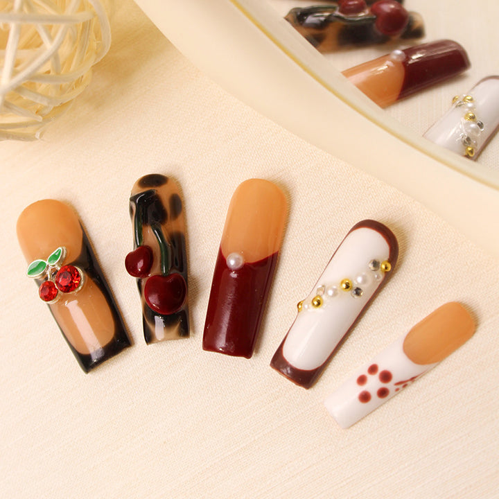 Nail art set with luxurious cherry and glitter accents Stornfield