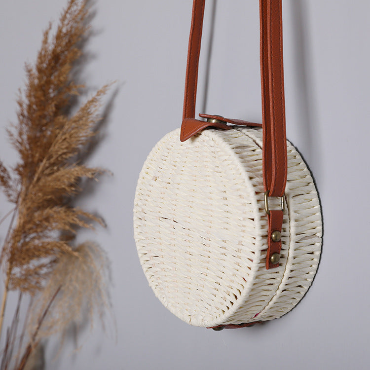 Round basket bag with leather accents Stornfield