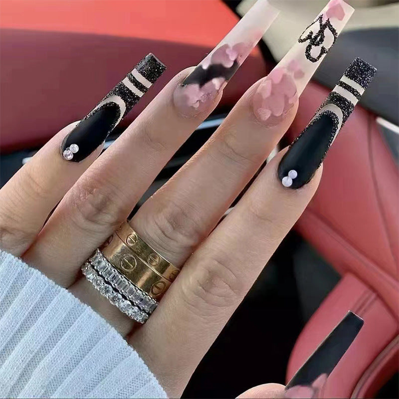 Artificial nail set with creative 3D elements and sparkling accents Stornfield