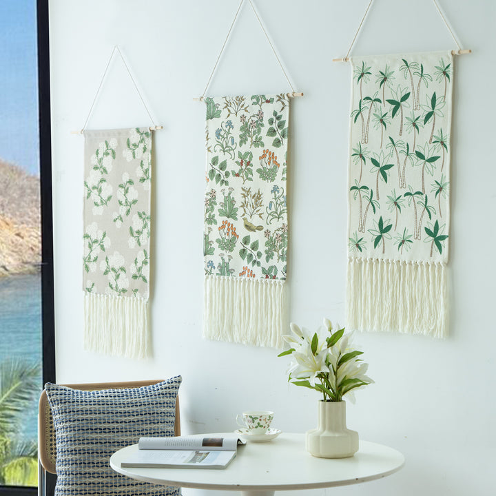 Woven wall hanging with floral jacquard structure and long fringes Stornfield