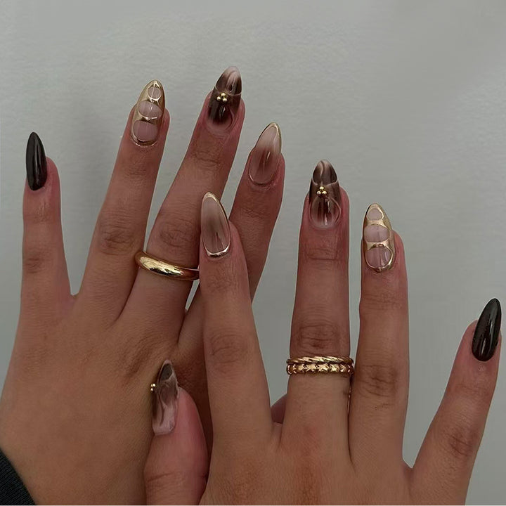Artificial nail set with elegant ombre design and gold embellishments Stornfield