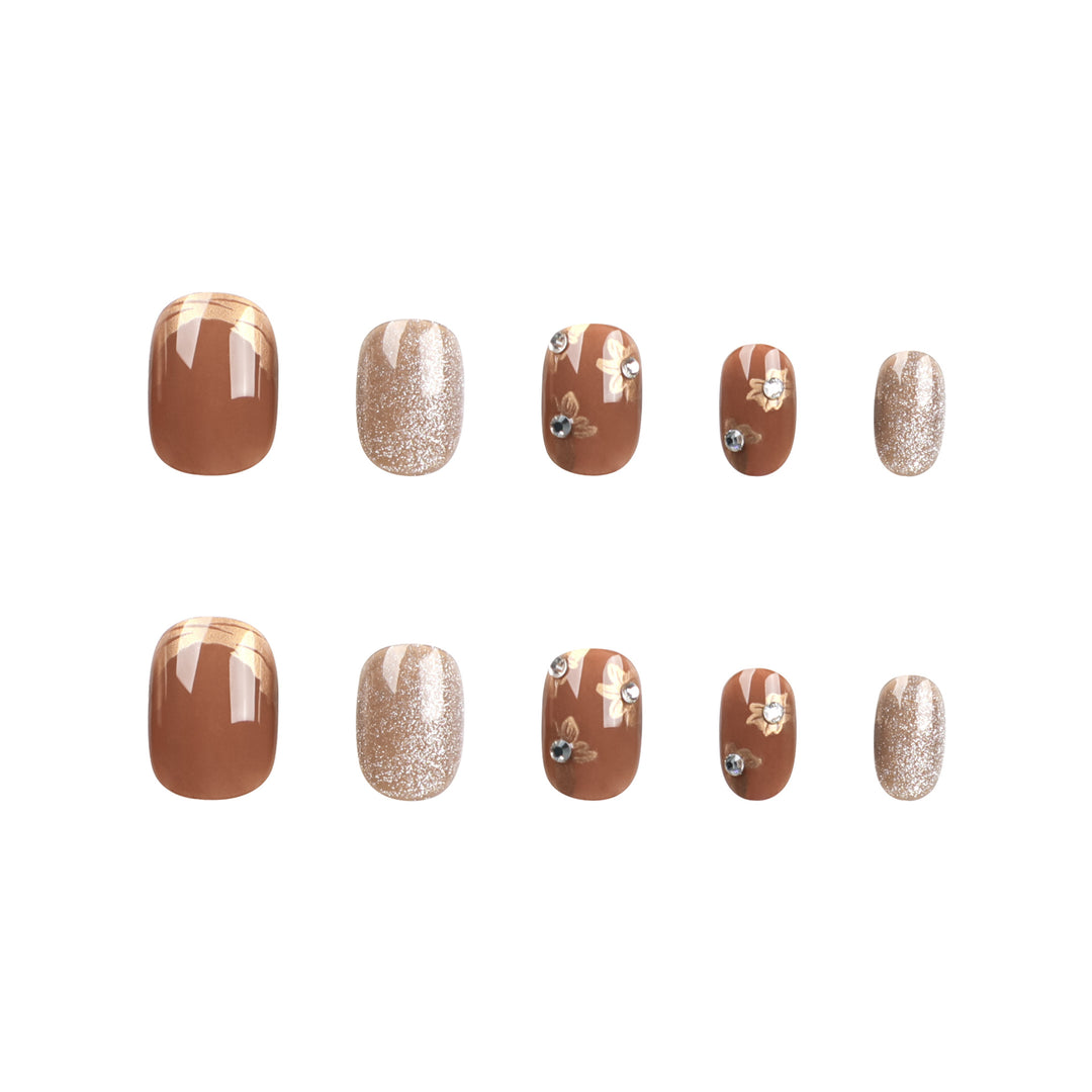 Elegant Nail Decoration with Glitter and Floral Accents Stornfield