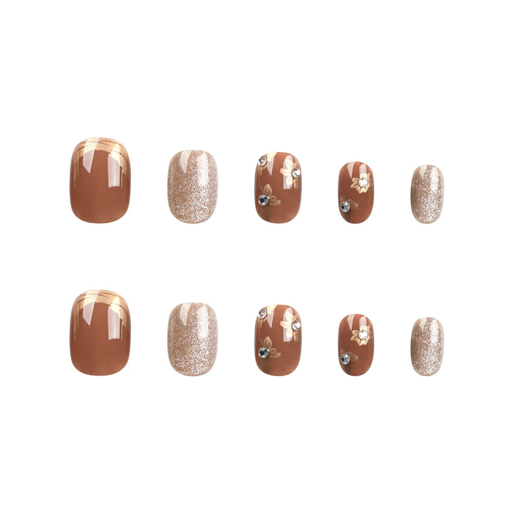 Elegant Nail Decoration with Glitter and Floral Accents Stornfield