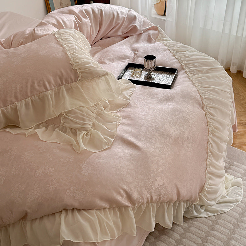 Satin bedding set with ruffled border and fine damask relief
