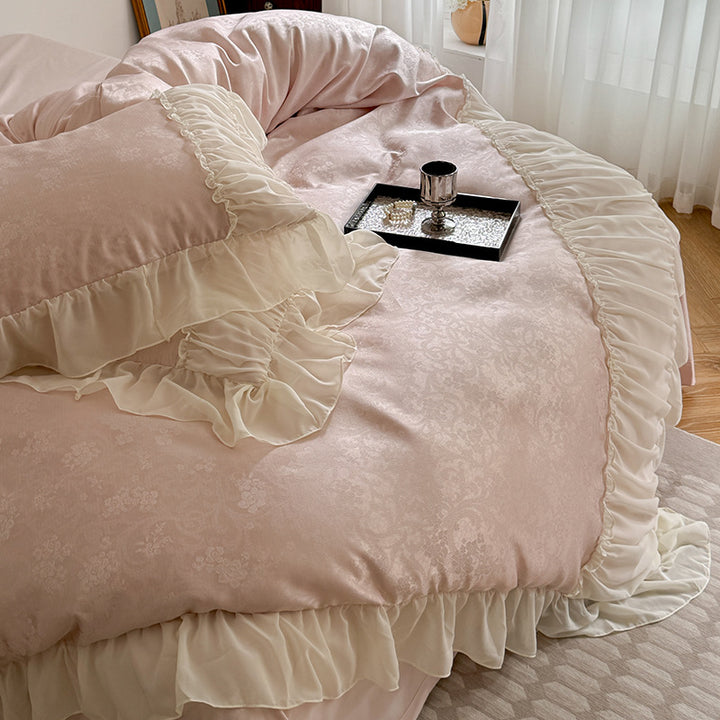 Satin bedding set with ruffled border and fine damask relief