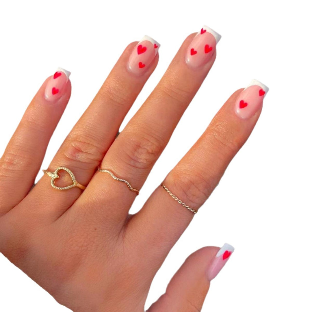 Heart-Embellished French Tip Nail Art Stornfield