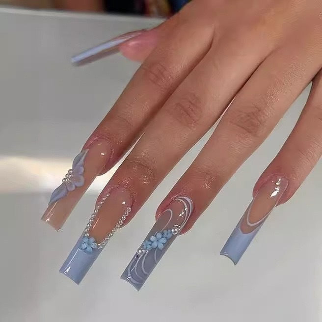 Art nail set with delicate floral accents and elegant embellishments Stornfield