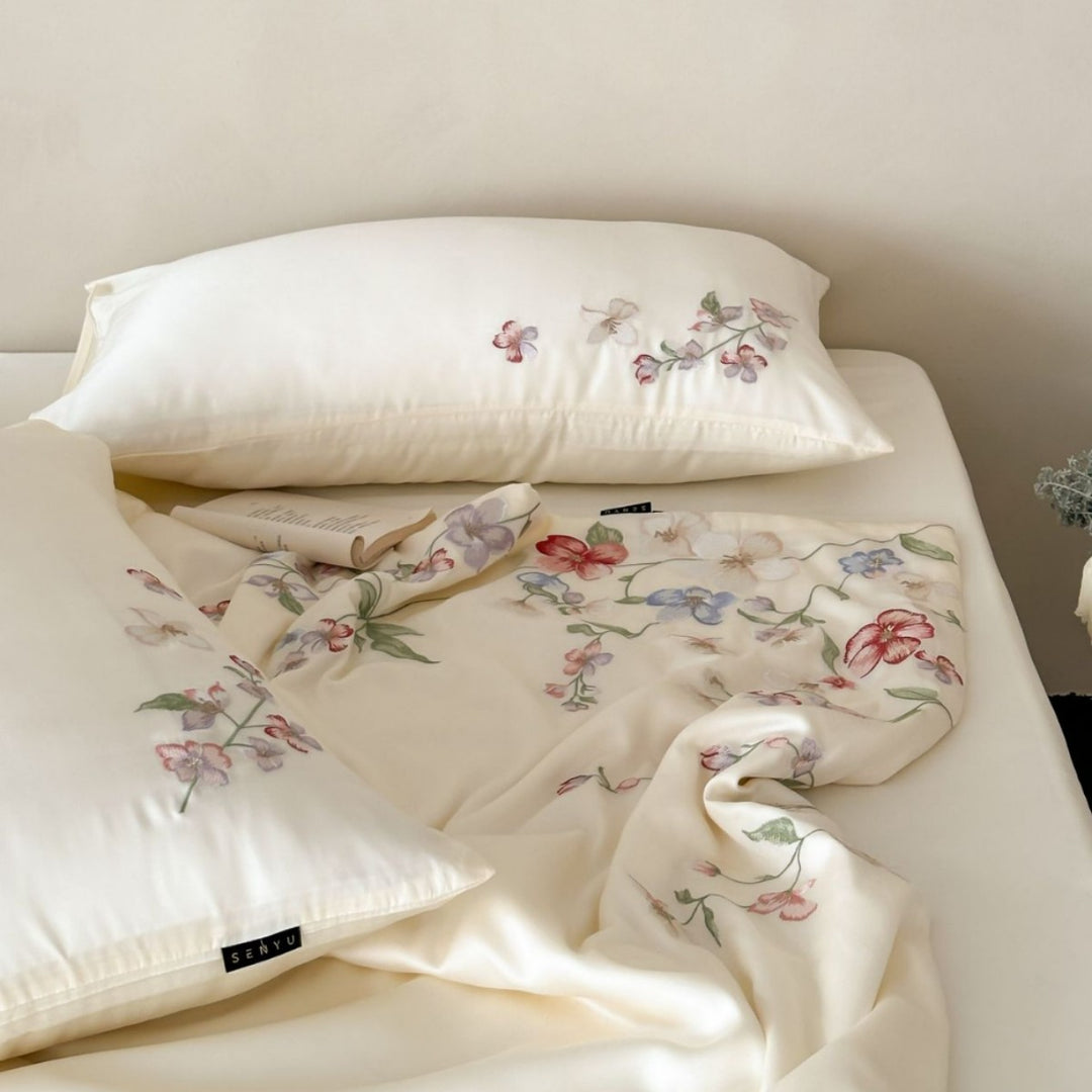 Luxurious bed linen set made of cotton satin with tonal floral embroidery and hotel closure