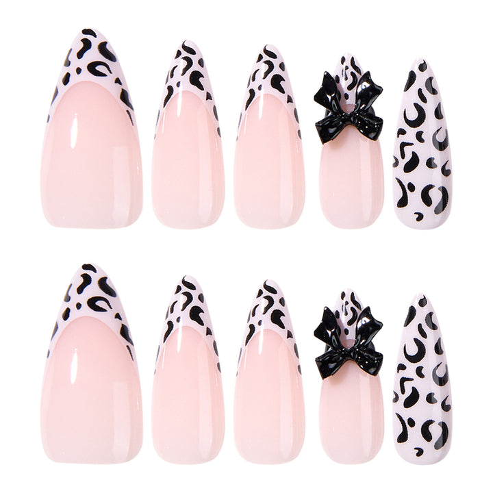 Artful Stiletto Nails with Leopard Print and Bow Accent Stornfield