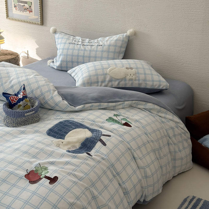 Plush bedding set with embroidered dog motif and striped cuddle blanket
