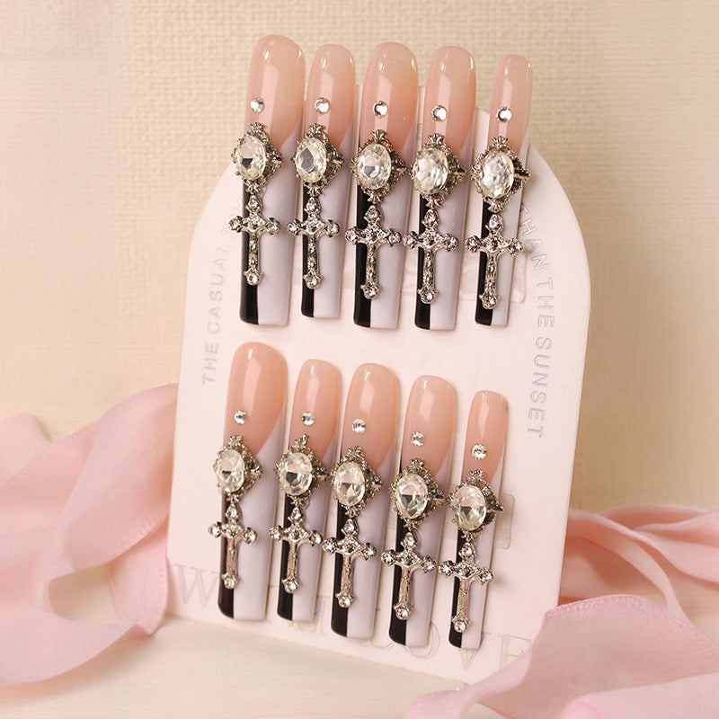 Glamorous artificial nails with elegant cross decorations Stornfield