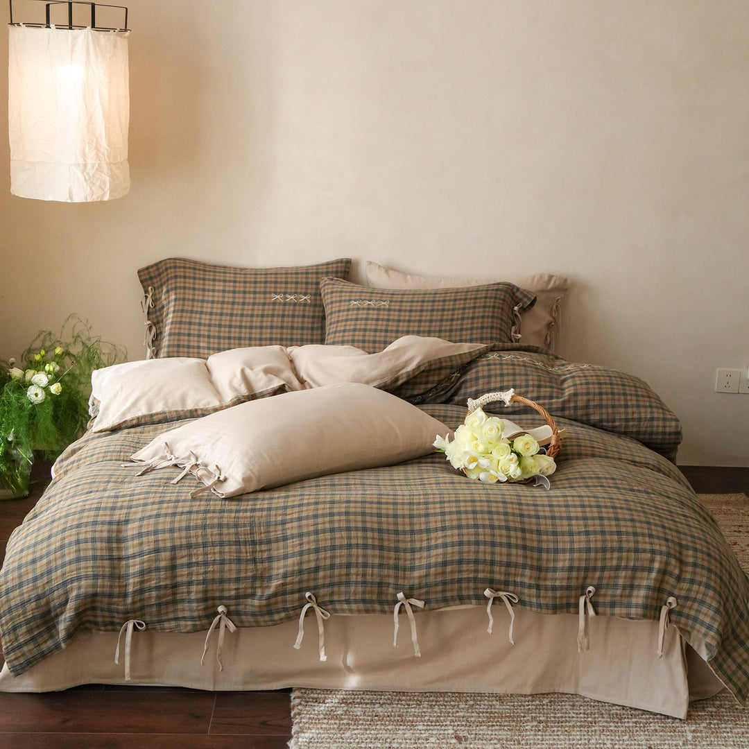 Checked cotton bedding set with decorative ribbons, ruffles, and subtly embroidered detail