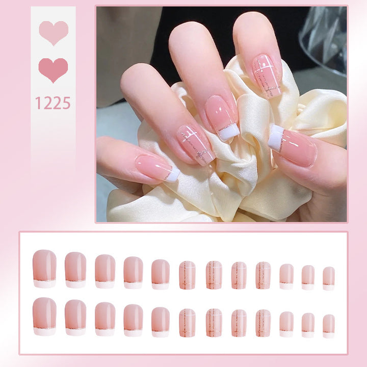 Nail set with elegant French tip and fashionable embellishments Stornfield