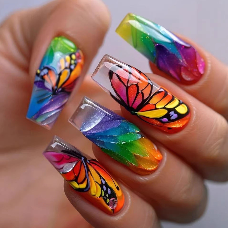 Artificial nails with colorful butterfly design and holographic accents Stornfield