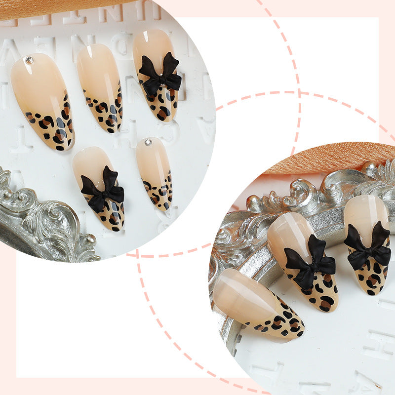Creative nail set with leopard design and glitter accents Stornfield