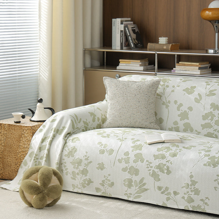 Elastic sofa cover with floral relief structure and universal fit