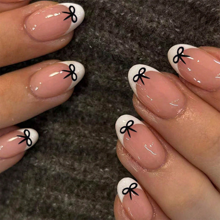 Acrylic nail set with playful bow design Stornfield