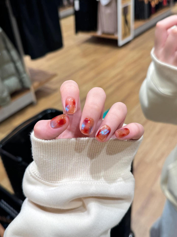 Artificial nails with shimmering galaxy patterns Stornfield