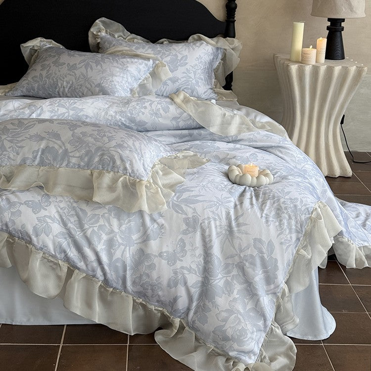 Elegant bedding set made of fine satin jacquard with delicate floral relief and decorative ruffle