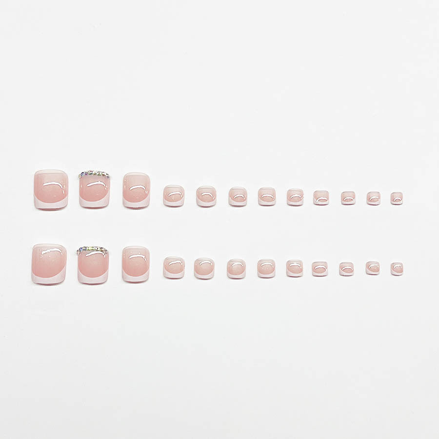 Nail art set with elegant French design and sparkling accents Stornfield
