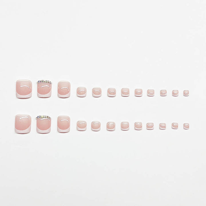 Nail art set with elegant French design and sparkling accents Stornfield