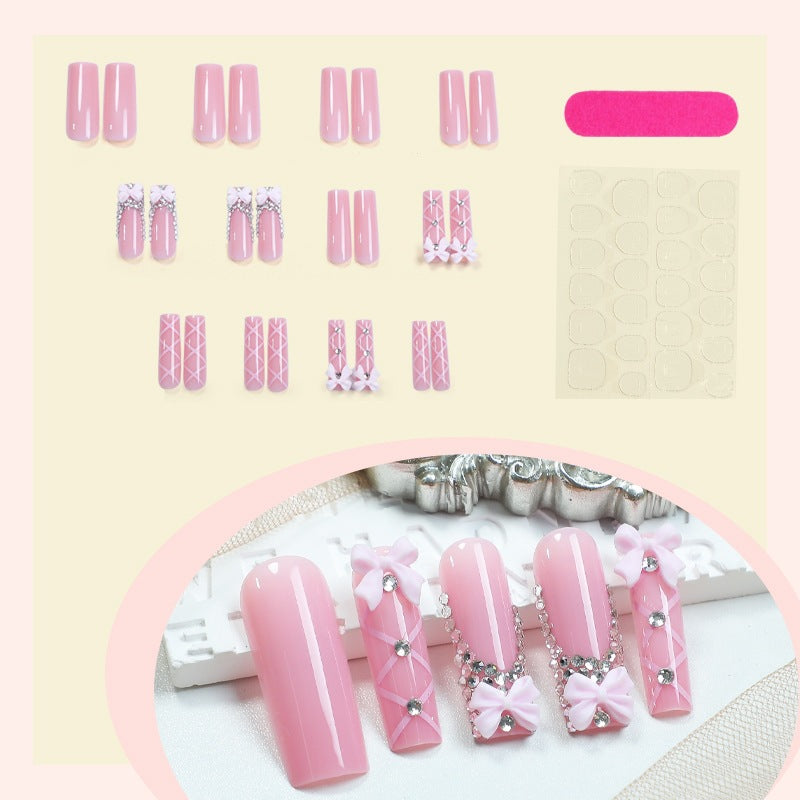 Artificial nail set with romantic bow and glitter accents Stornfield