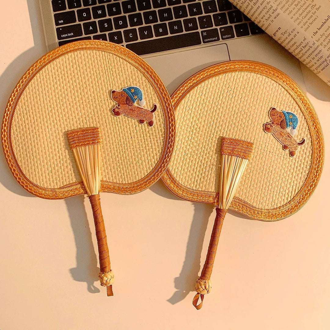 Handcrafted fan with playful dog motif Stornfield