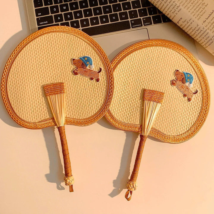 Handcrafted fan with playful dog motif Stornfield