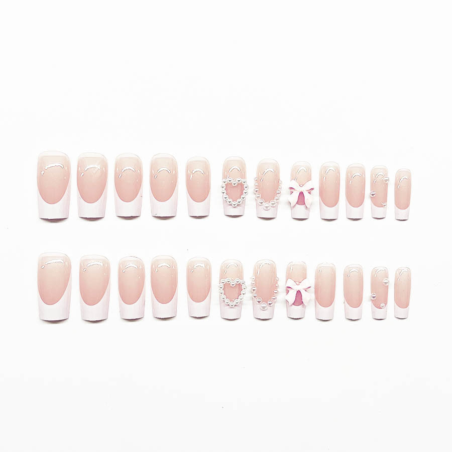 Artificial nail set with elegant 3D flowers and pearl embellishments Stornfield