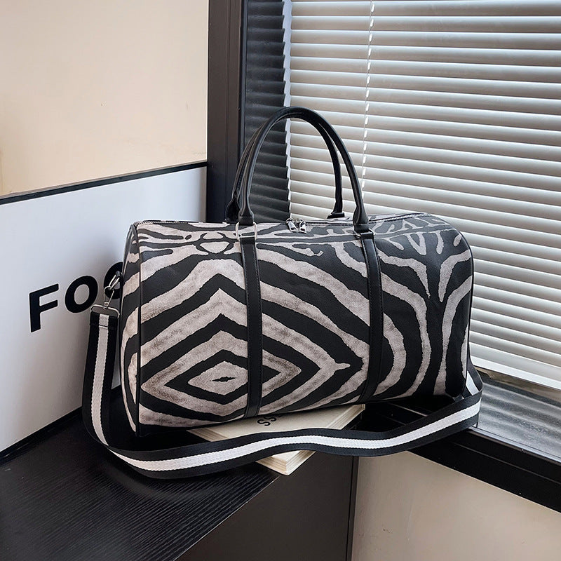 Sporty travel bag in trendy zebra pattern Stornfield