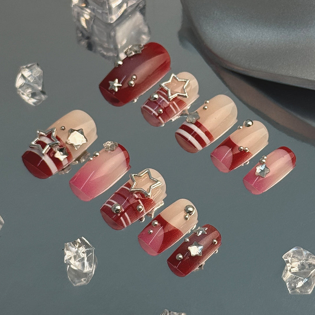 Artificial fingernails with handcrafted star decorations Stornfield