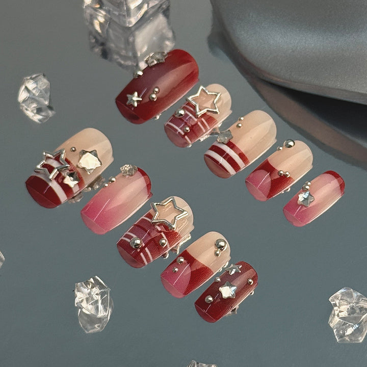 Artificial fingernails with handcrafted star decorations Stornfield