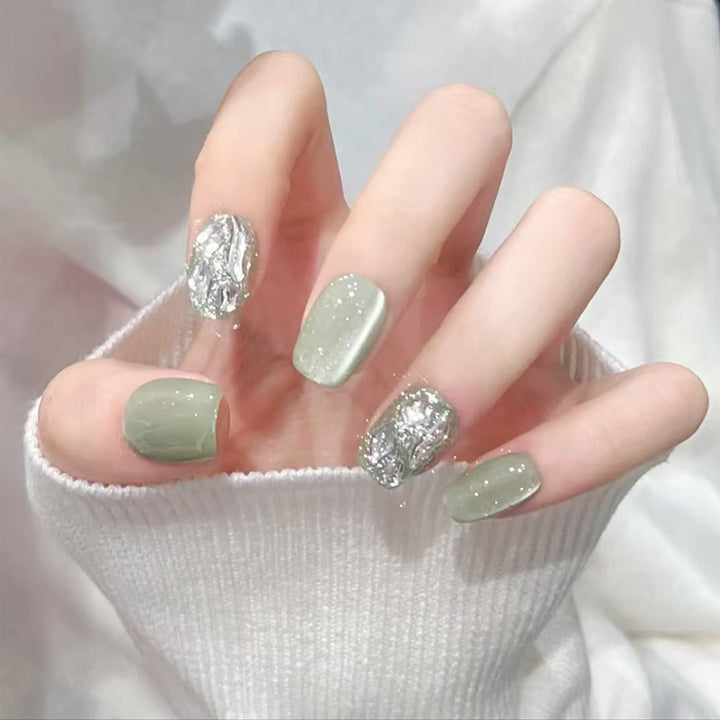 Acrylic nail set with elegant glitter design and creative effects Stornfield