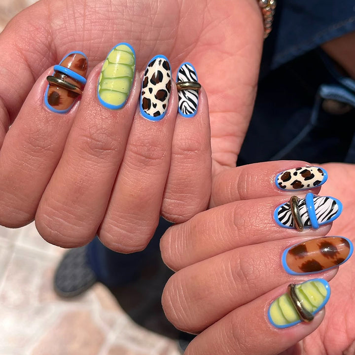 Creative art stick-on nails with modern animal motifs and colorful accents Stornfield