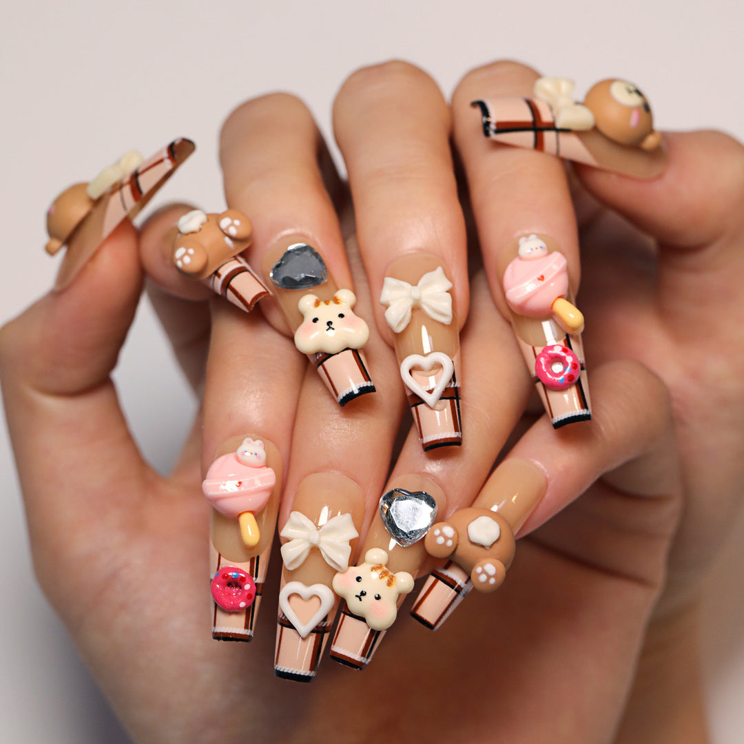 Artificial nail art with cute animal and candy motifs Stornfield
