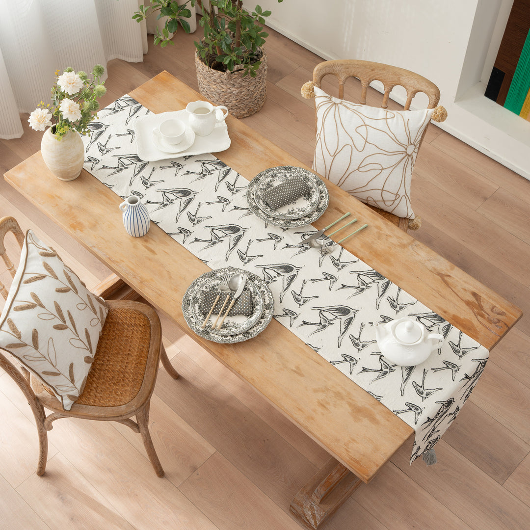 Elegant linen table runner with tassels and decorative print